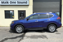 Black 2019 Nissan Rogue with dark privacy window tint